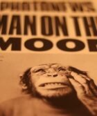 a close up of a newspaper with a monkey on it